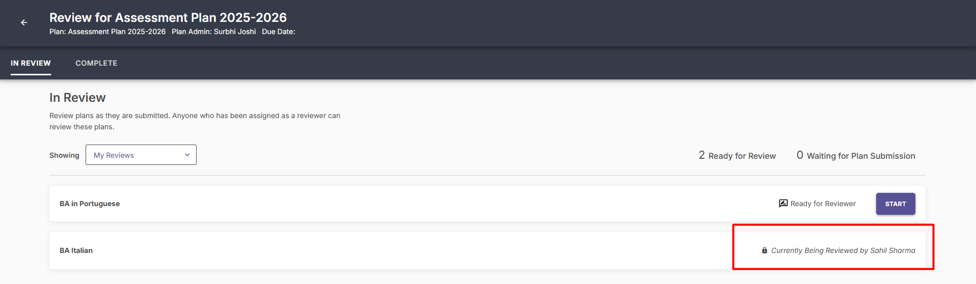 The 'In Review' dashboard showing a lock icon and a status message indicating that an organization is currently being reviewed by another user.
