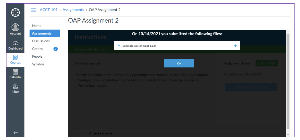 The assignment page showing a pop‑up message stating that on the listed date the submitted file displayed, with the file name given above an Ok button.